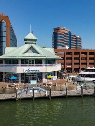 a boat is docked next to a body of water