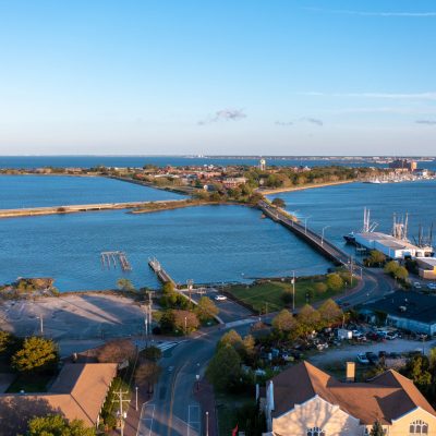 a view of a large body of water with a city in the background