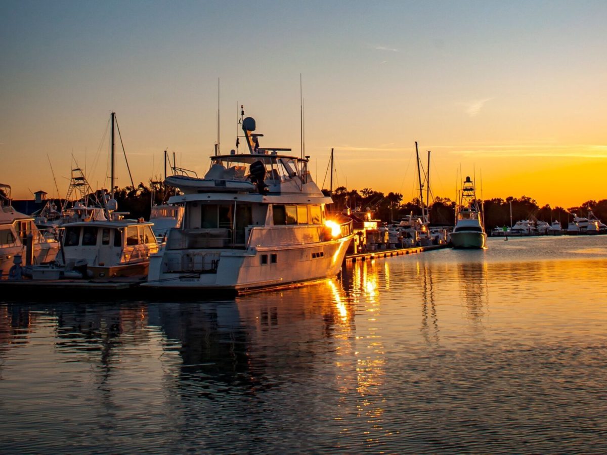 a boat is docked next to a body of water