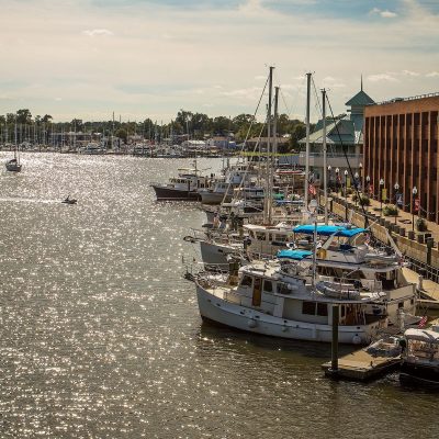 a boat is docked next to a body of water